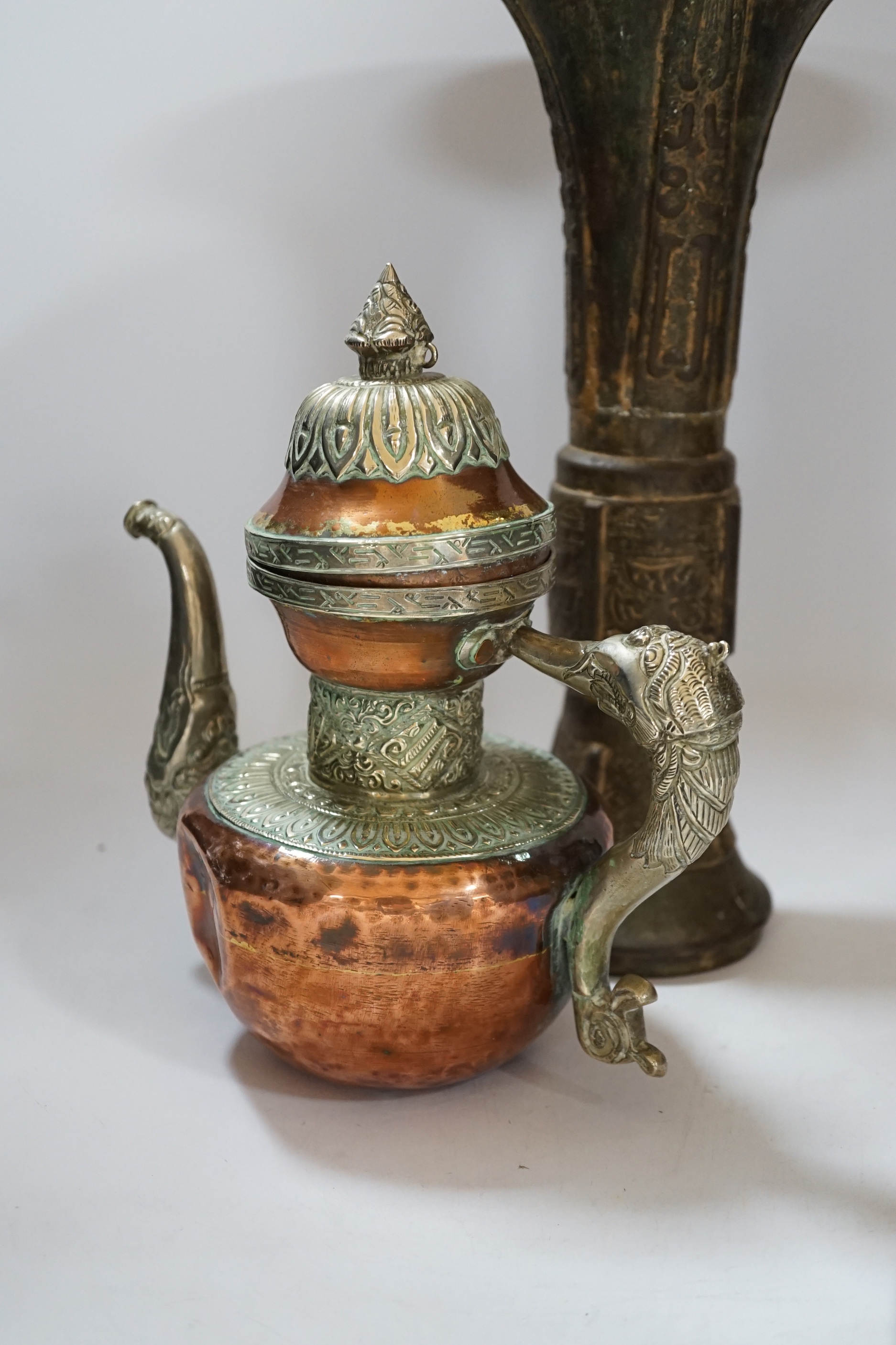 A Chinese bronze gu vase, a 19th century Chinese blue and white vase and a Tibetan teapot, tallest 34cm